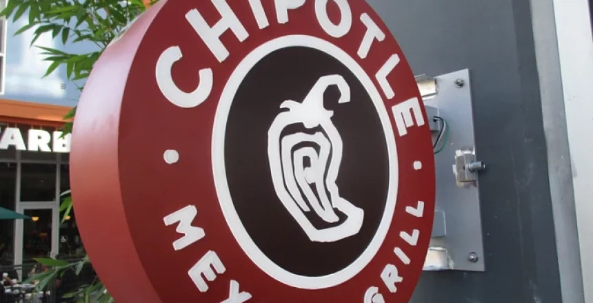 Round Chipotle Mexican Grill sign with a chili pepper logo.